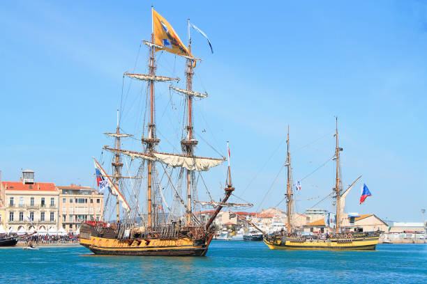 Seven, France SETE, FRANCE - March 24, 2016: Russian frigate Shtandart in imaginary battle with Czech frigate La Grace during the "Stopover in Sete" - Maritime Traditions Festival from the 22 to 28 march 2016 In Sete, South of France stopover stock pictures, royalty-free photos & images
