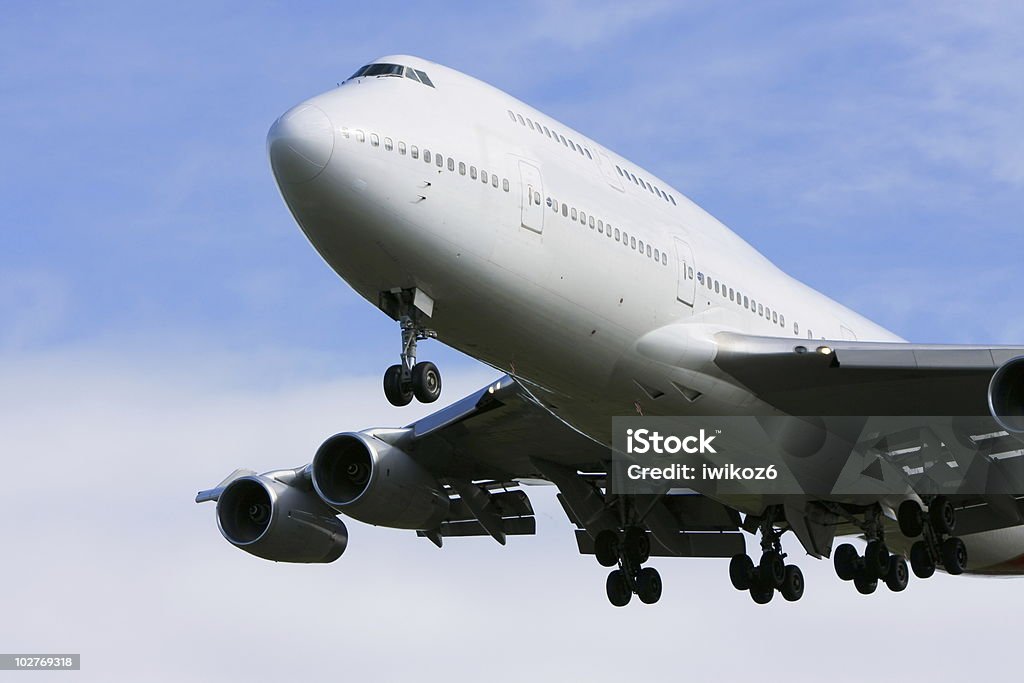 Boeing 747 airliner flying low overhead  Airplane Stock Photo