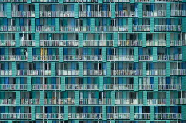 istock Background of a modern architecture texture of a skyscraper wall with balconies and windows 1027693668