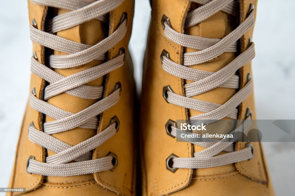 Women's winter boots. Yellow warm boots for trekking Women's winter boots. Yellow warm boots for trekking. Adventure Stock Photo