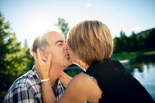 istock Couple outdoors by lake having good time 1027698170