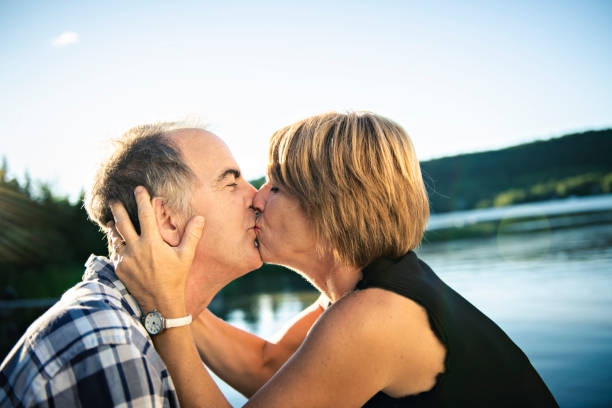 istock Couple outdoors by lake having good time 1027698200
