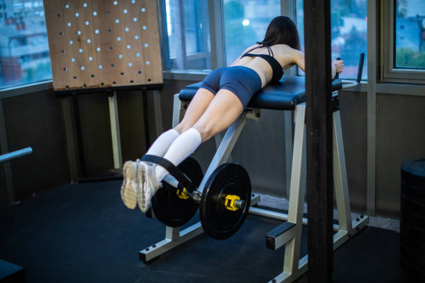 istock Woman exercising in the gym 1027709506