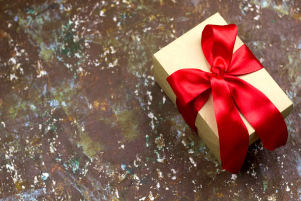 istock festive gift boxes brown shabby vintage background 1027714888