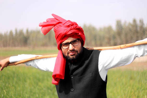 Farmer portrait near green field