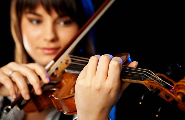 istock blurred female violinist 102773064