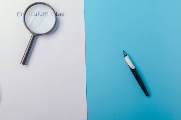 istock Curriculum vitae written on an blank white paper 1027735316