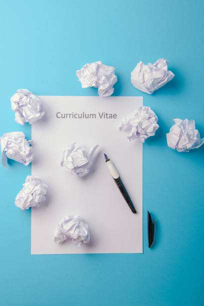 istock Curriculum vitae written on an blank white paper 1027735474