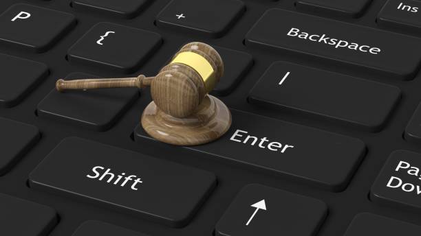 istock 3D rendering of gavel on black keyboard 1027746230