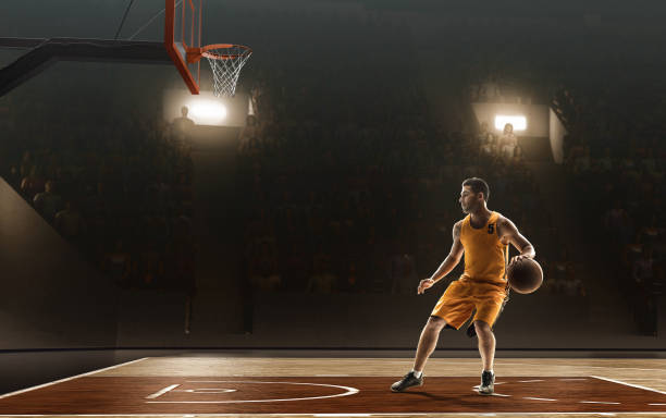 istock Basketball player with a ball taking a shot 1027746726