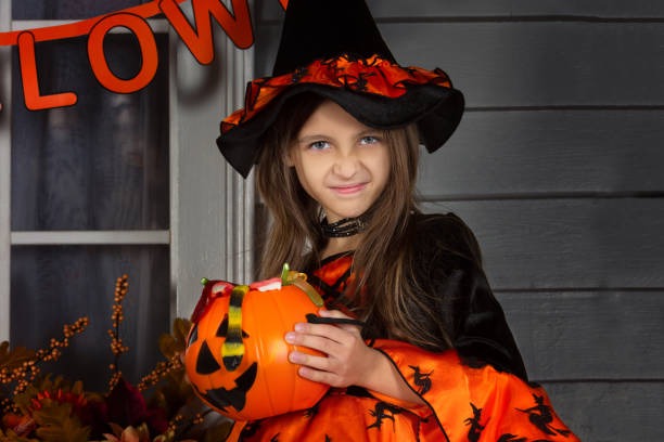 istock Girl in Halloween witch costume 1027747066