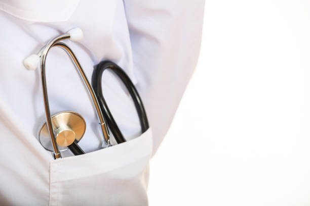 istock Doctor with a stethoscope on white background 1027747426