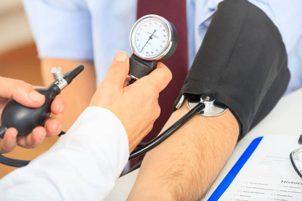 istock Doctor measuring blood pressure 1027751832