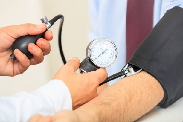 istock Doctor measuring blood pressure 1027751848