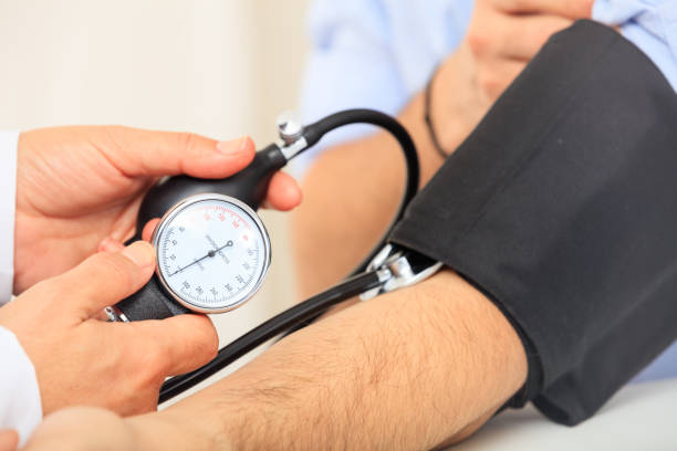 istock Doctor measuring blood pressure 1027751850