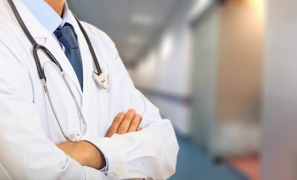 istock Doctor with a stethoscope on hospital background 1027751960