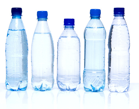bottles with water on white