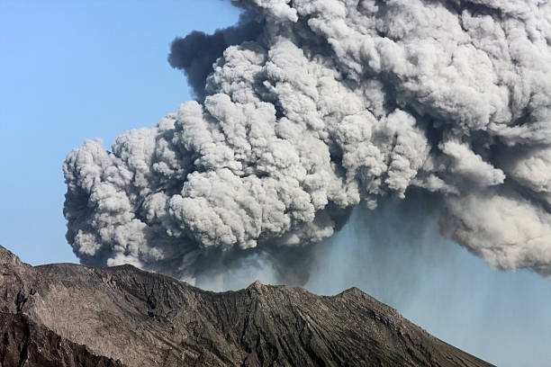 Plumes of smoke billowing out of Sakurajima volcano stock photo