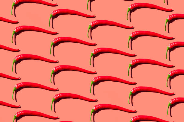 Red Chili Pepper Red Chili Pepper isolated on red background chili pepper pattern stock pictures, royalty-free photos & images