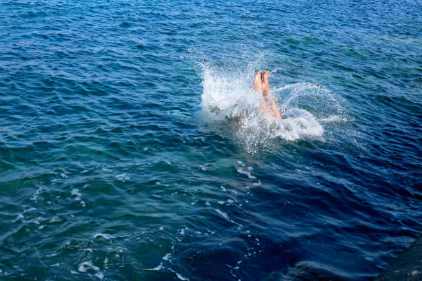 istock Jump in the blue sea 1027753256