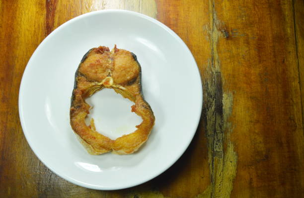 istock fried salty striped catfish on dish 1027758104