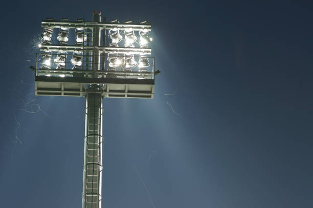 istock Stadium lights turned on and some insects at night 1027758116