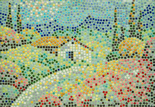 Small cubes of mosaic lined with a landscape of houses, trees, fields and meadows