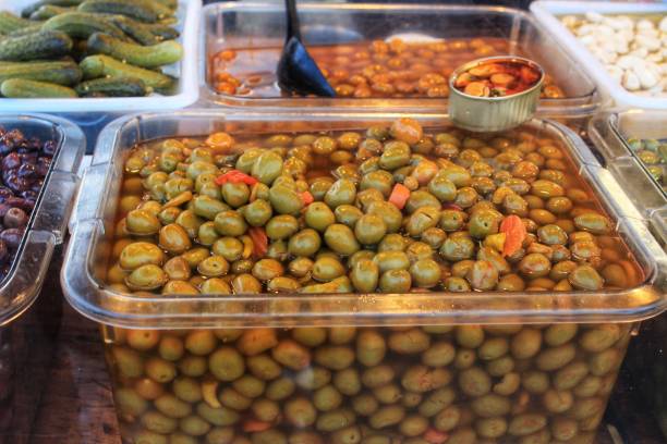 istock Olives and pickles at a market stall 1027765134