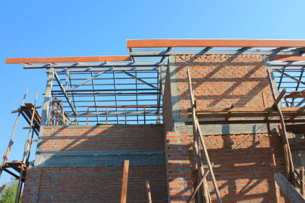 istock A new house brick and mortar structure building and construction. 1027768084