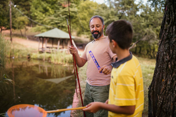 istock Father and son fishing together 1027768086