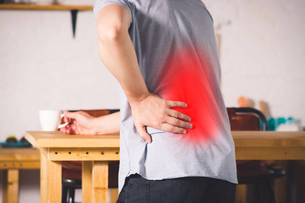 istock Back pain, kidney inflammation, man suffering from backache at home 1027768312