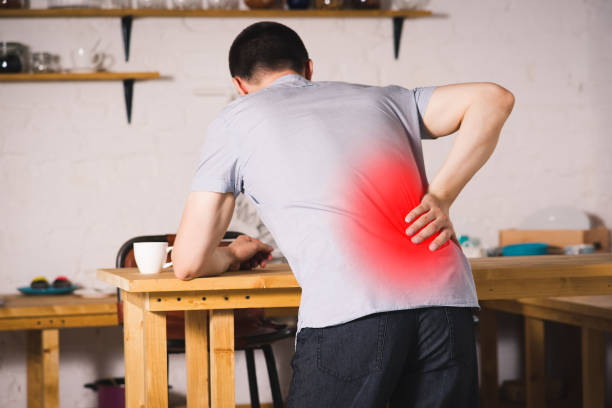 istock Back pain, kidney inflammation, man suffering from backache at home 1027768710