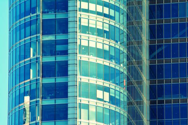 istock Modern office building on a clear sky background. Retro stylized colorful tonal filter effect 1027768954
