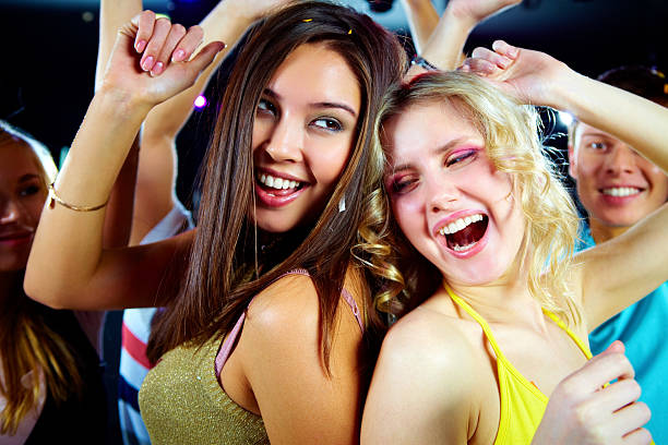 istock Two girls dancing with their backs to each other 102776910