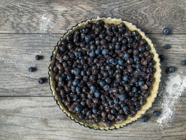 istock Ingredients and pie crust for blueberry tart 1027780436