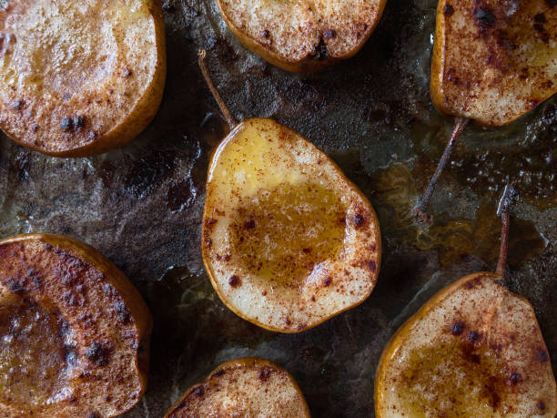 baked pears with maple syrup and cinnamon stock photo