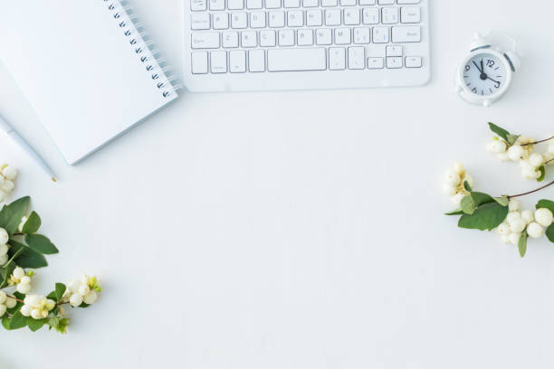 istock Flat lay desk and branch with green leaves 1027796308
