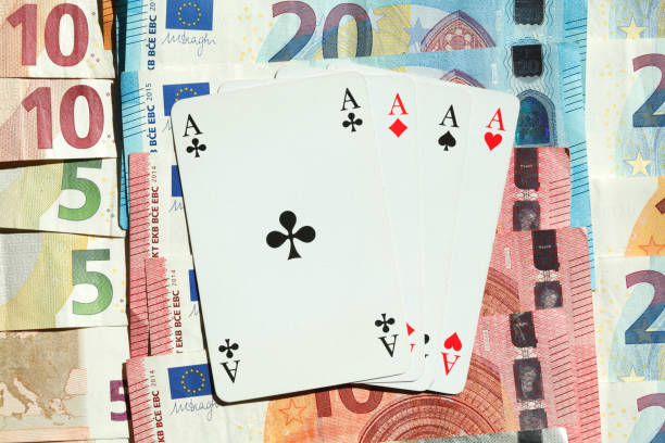 istock Playing cards Four Aces, Euro Banknotes 1027801084