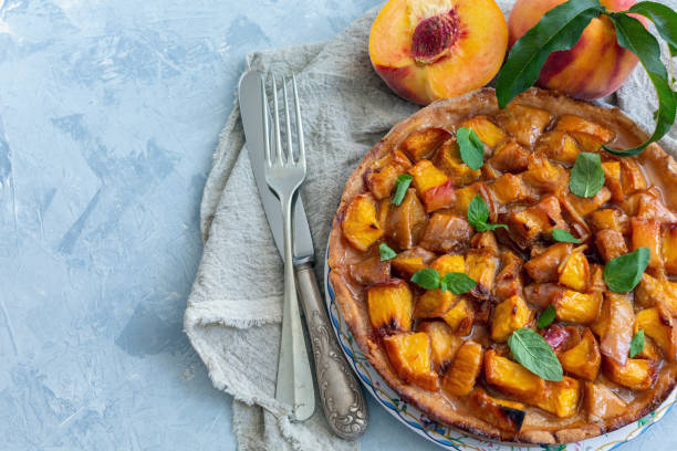 istock Homemade pie with peaches and fresh mint. 1027801170