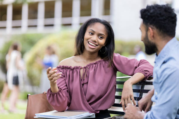 istock Young couple on college campus 1027807524