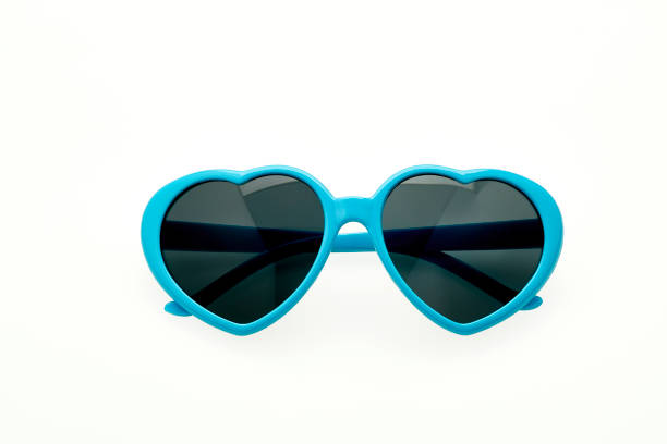 istock Heart shaped sunglasses on white background - blue frame 1027807602