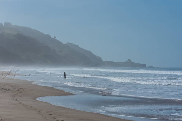 istock Fisherman on a beautiful beach in California 1027810958