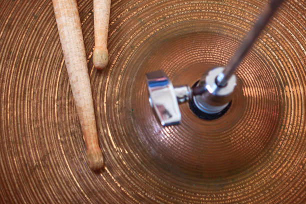 istock Pair of drumsticks lying on cymbal. 1027816532