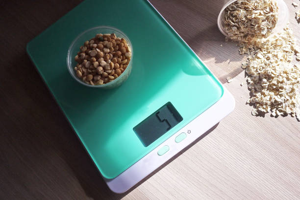 istock Small kitchen scale for weighing products in the kitchen. 1027816812