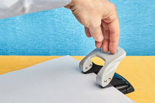 istock Office instrument for making holes in paper. 1027819014