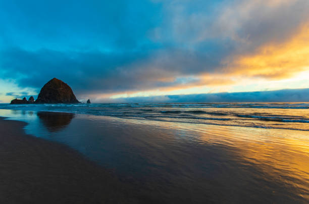 istock Wide angle view of Haystack Rock at sunset 1027819522