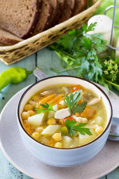 istock Healthy food: Chicken and Chickpea Soup on wooden table. Diet menu. Copy space. 1027823418