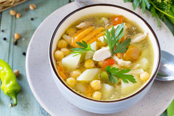 istock Healthy food: Chicken and Chickpea Soup on wooden table, close-up. Diet menu. 1027823426