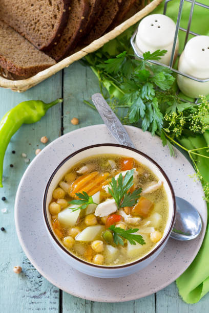 istock Healthy food: Chicken and Chickpea Soup on wooden table. Diet menu. 1027823432