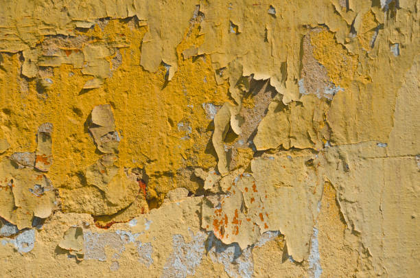 istock Abstract background of cracked and peeling yellow paint 1027825926